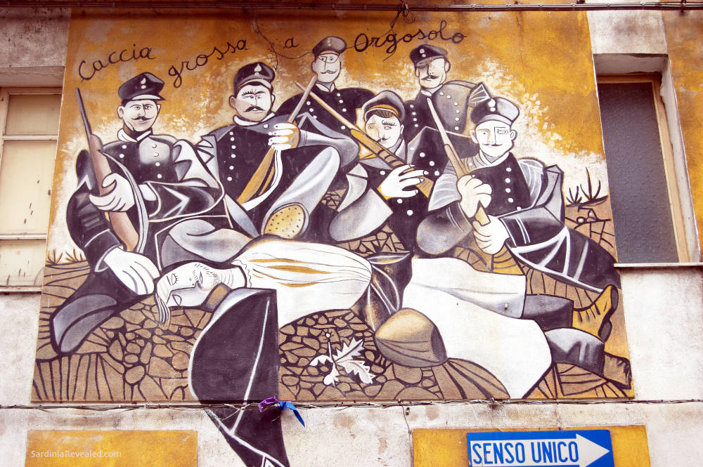 Image: Political street art in Orgosolo, one of the towns to visit in Sardinia.